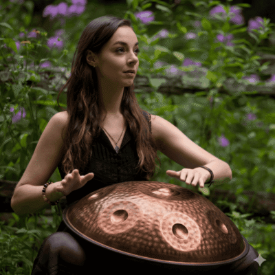 Emma playing stainless steel professional level saraz in the forest