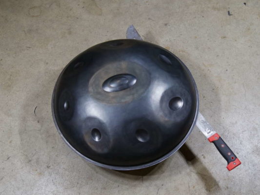 cutting open a handpan repair