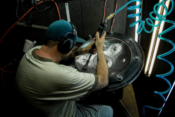 shaping a handpan with pneumatic hammer